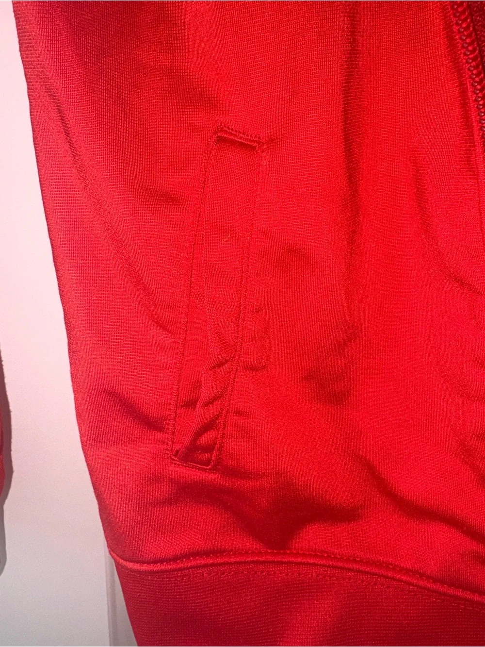 Nike Red Track Jacket with Navy Shoulder Panels and orange Logo